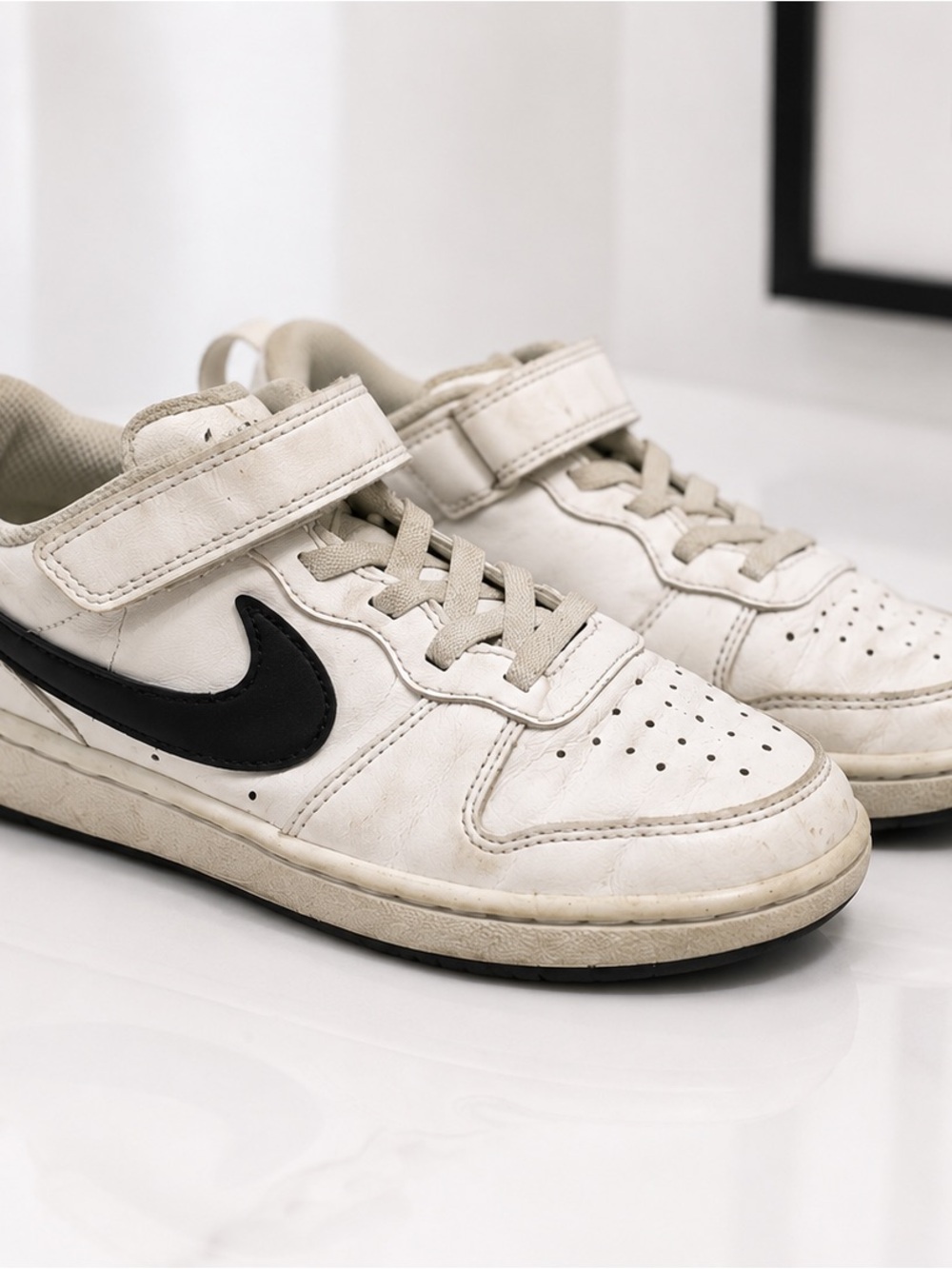 Nike Kids White Sneakers with Black Swoosh and Cream Accents